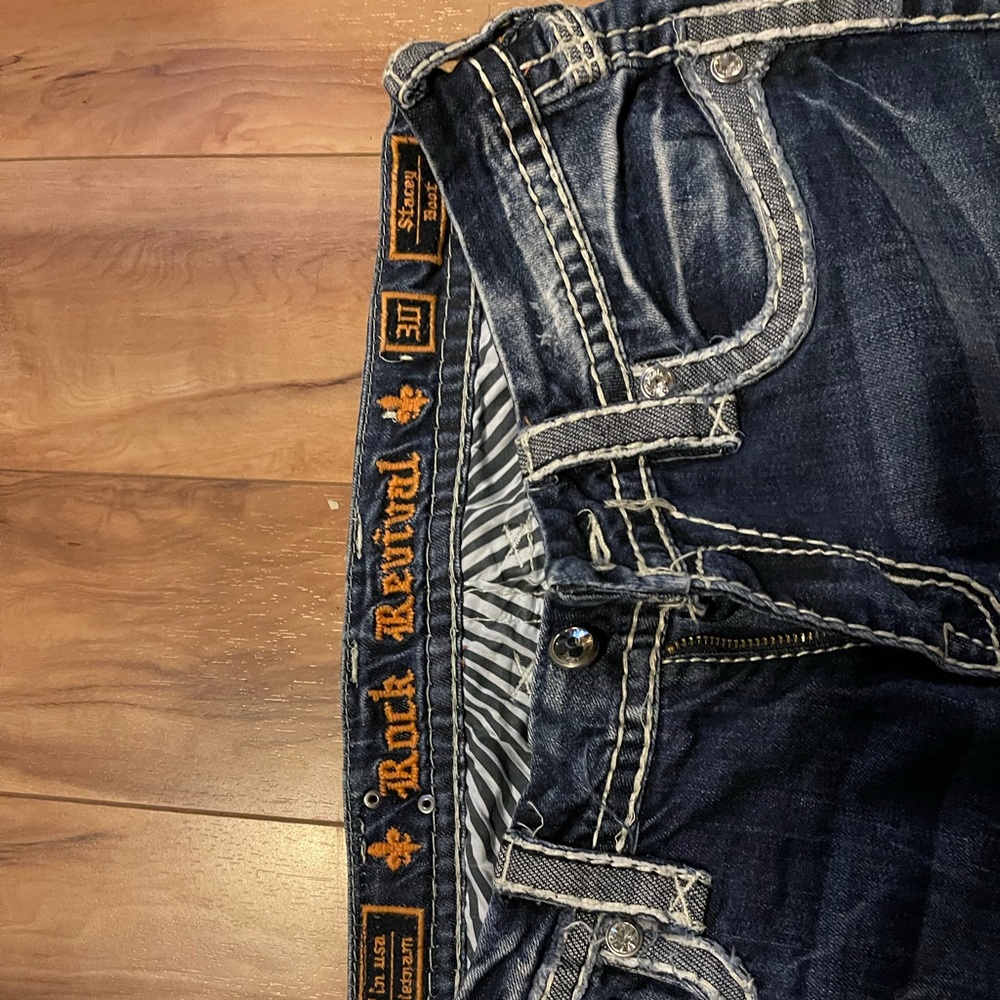 Rock revival boot cut distressed jeans